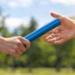 running baton being handed over
